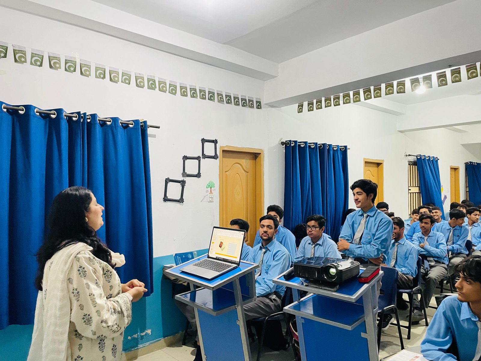 Teacher guiding a student in class